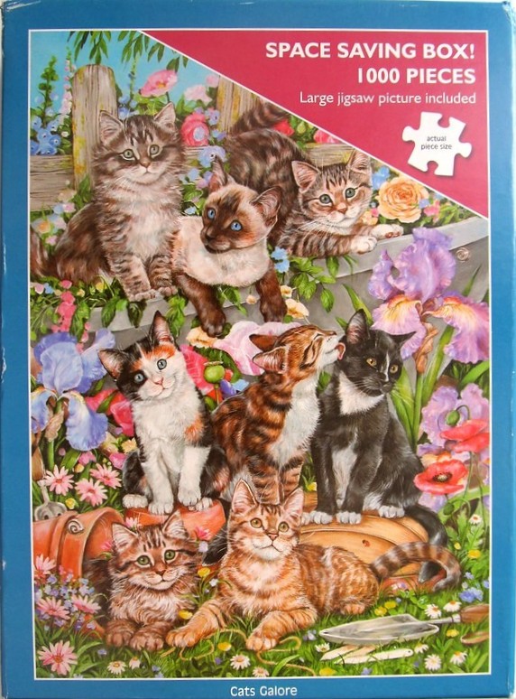 An illustration of seven kittens playing in a lush garden filled with flowers and gardening tools.