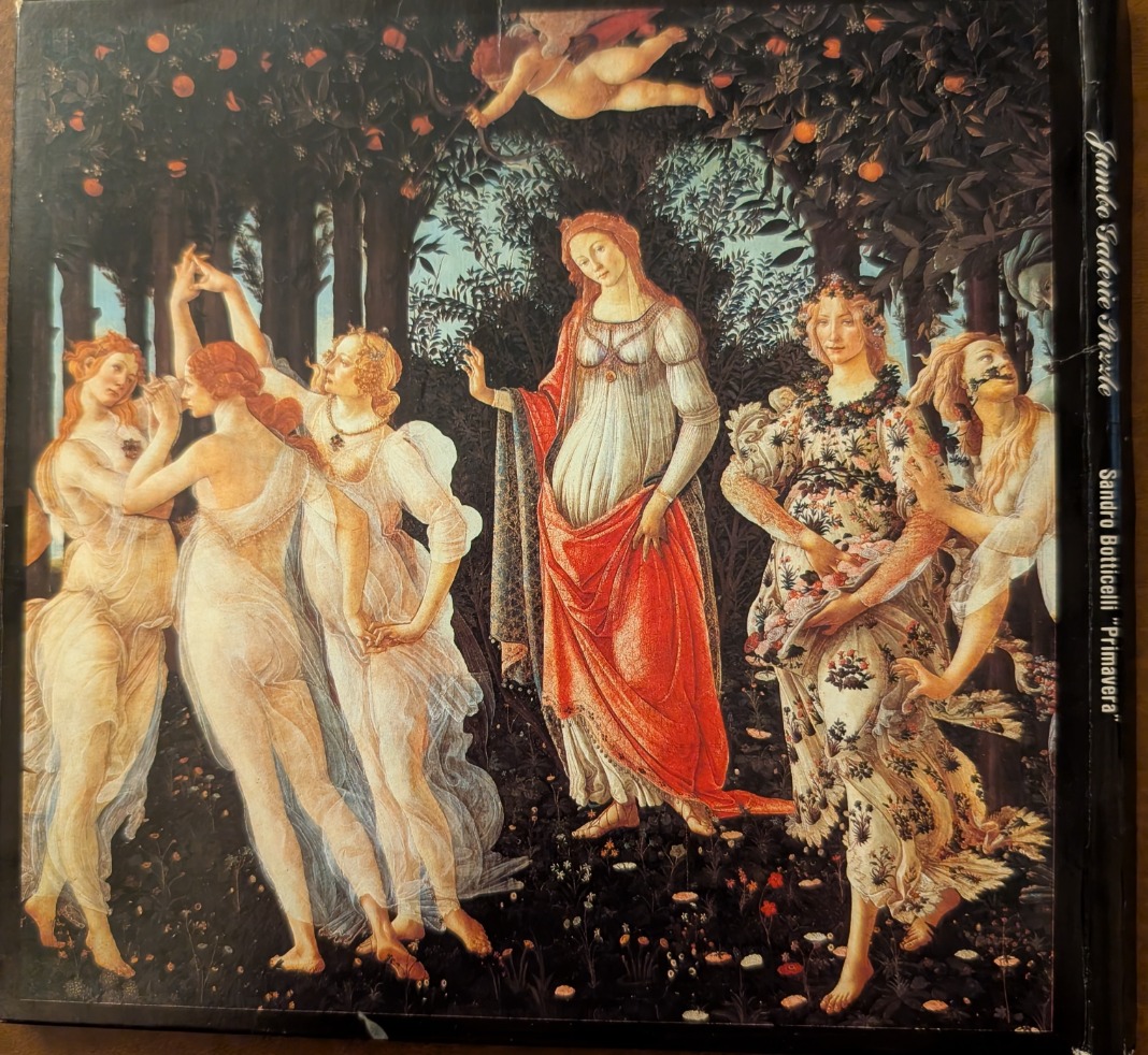 A reproduction of Botticelli's Primavera featuring mythological figures in a lush orange grove.