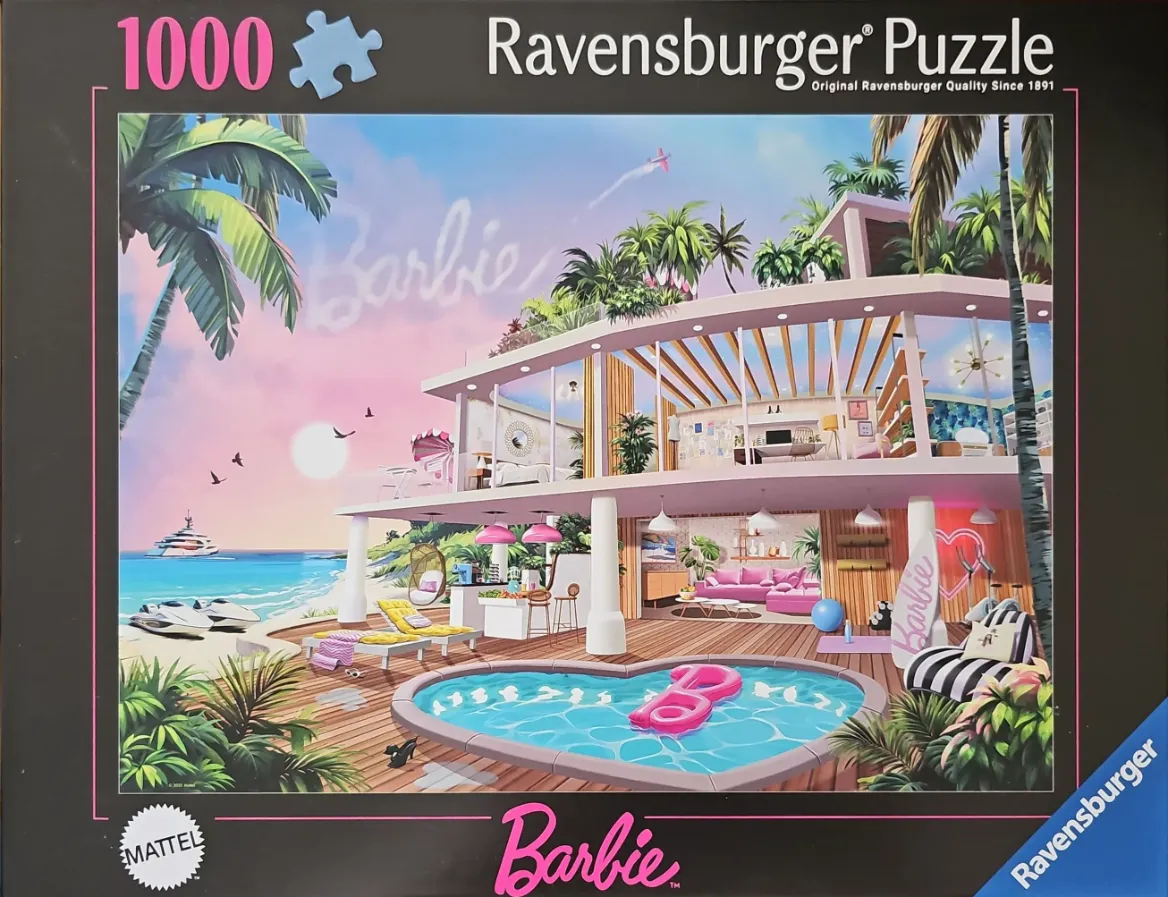 A modern Barbie-themed beach house with a heart-shaped pool at sunset.