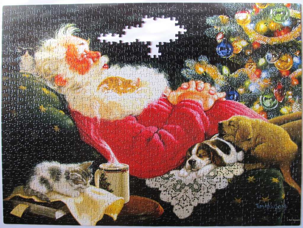 Santa Claus dozing in a chair next to a decorated Christmas tree with a cat and dog resting nearby.
