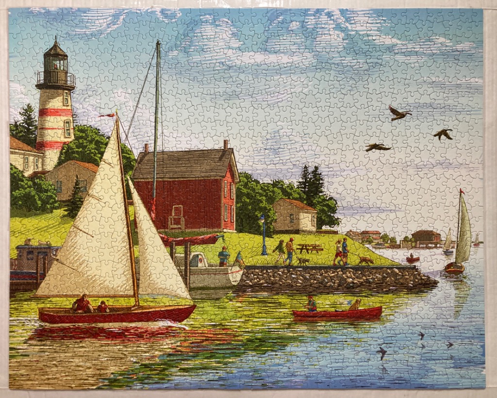 Coastal scene featuring a red and white lighthouse, a sailboat, and a red building near a harbor.