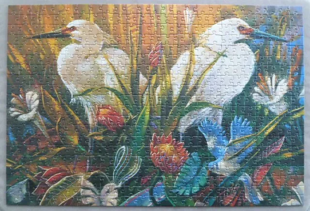 Two white egrets standing amongst vibrant, stylized tropical foliage.