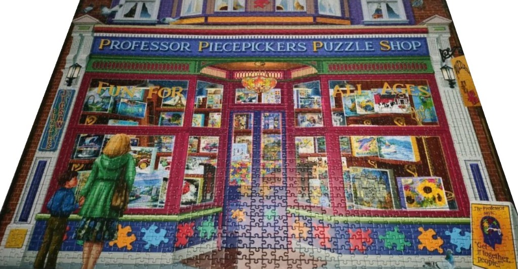 A colourful storefront named Professor Piecepickers Puzzle Shop with a woman and child looking into the display window.