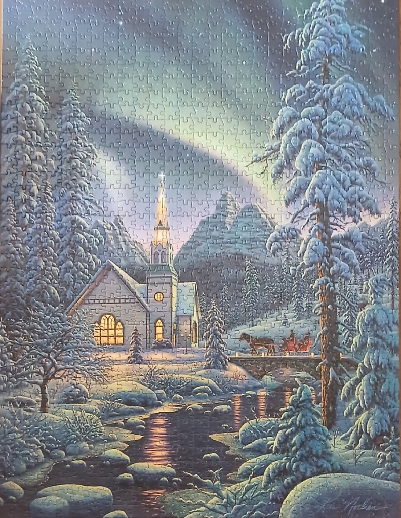 A peaceful snowy winter scene with a church, a horse-drawn sleigh, and northern lights in the sky.