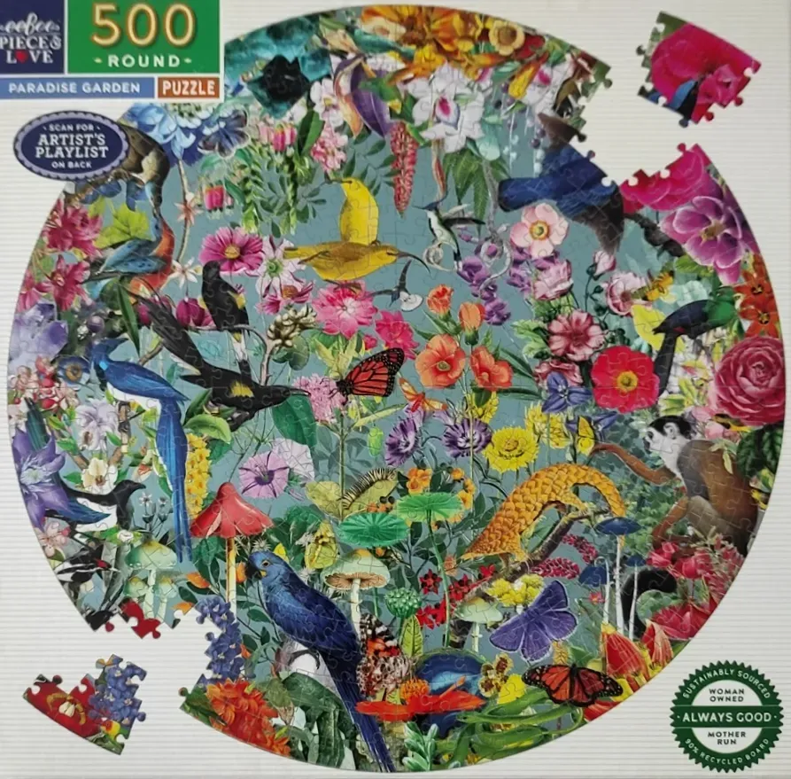 A circular collage of vibrant tropical birds, butterflies, a monkey, and exotic flowers against a dusty blue background.
