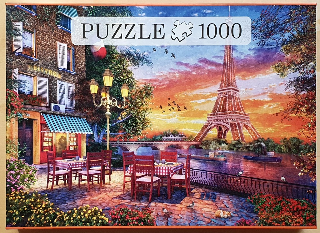 A romantic Parisian street scene at sunset featuring a bistro, the Eiffel Tower, and a riverside setting.