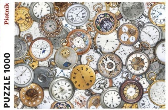 A dense, overlapping collection of antique pocket watches of various styles, sizes, and metallic finishes.