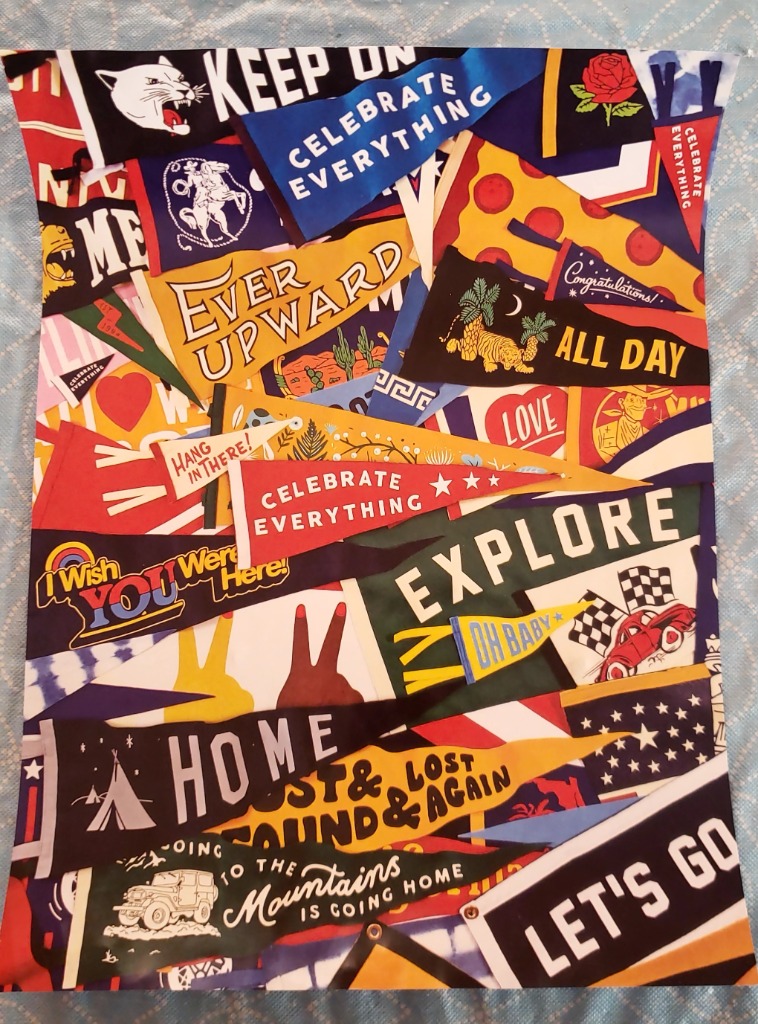A collage of various colorful pennants featuring diverse illustrations and inspiring slogans.