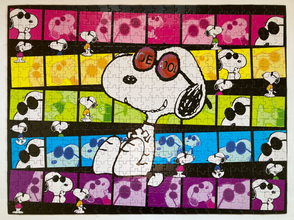 A collage of Snoopy wearing sunglasses, featuring a large central Joe Cool character overlaid on a grid of colorful panels.