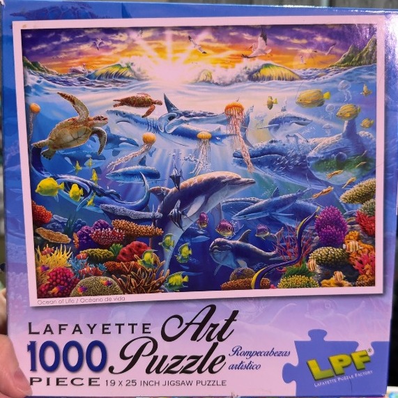Underwater scene filled with various marine life like dolphins, sea turtles, sharks, and a coral reef