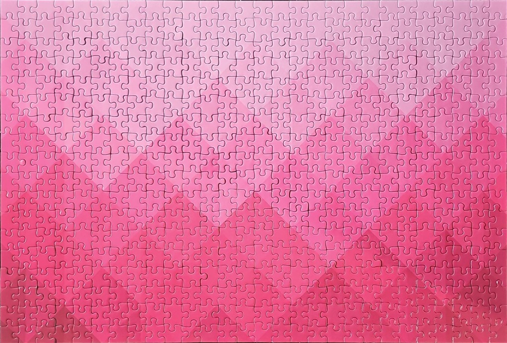 Abstract design of pink mountain-like chevrons in a gradient pattern.