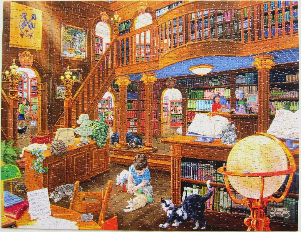 A cozy, multi-level library filled with cats, books, and a child sitting on the floor.