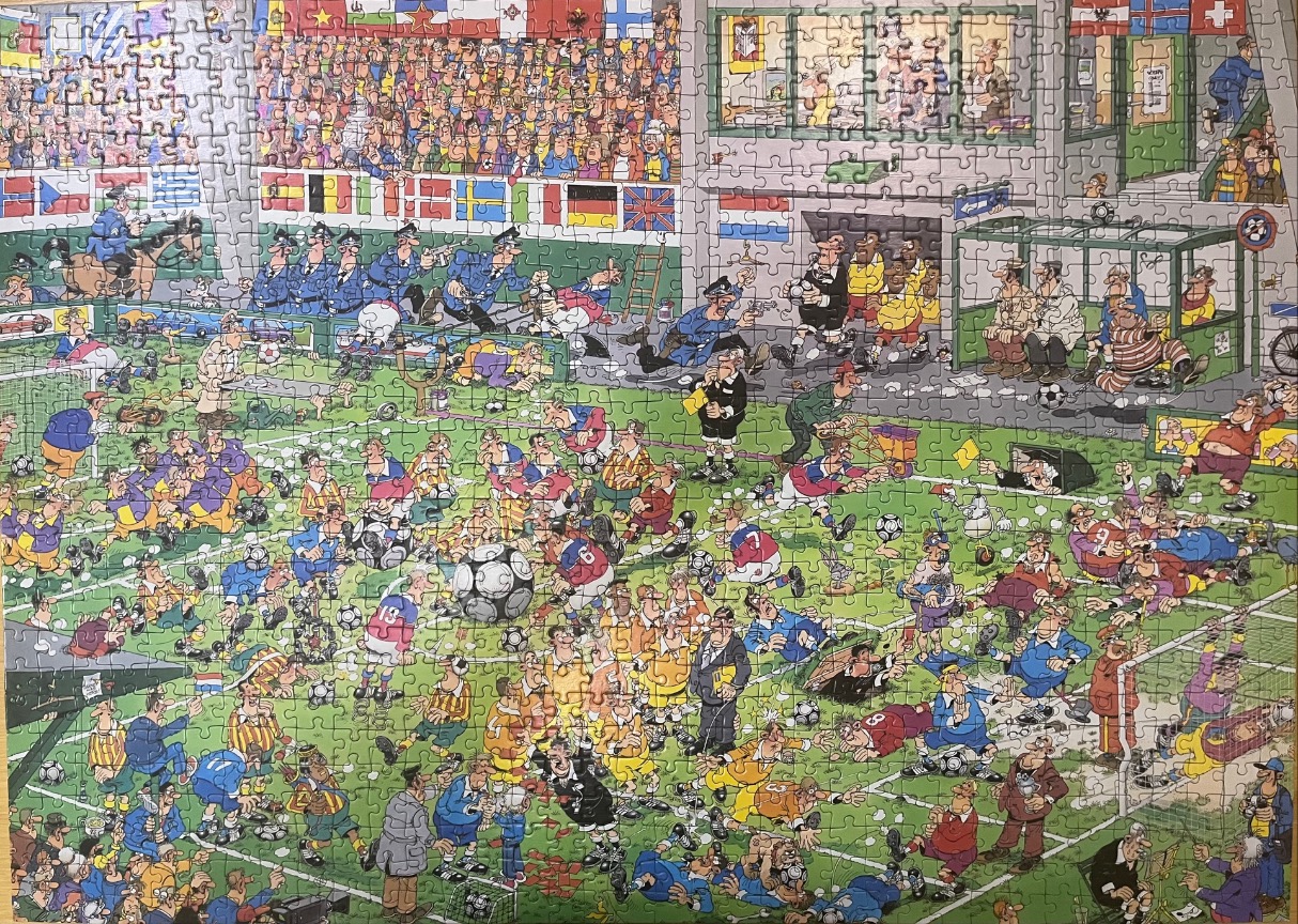 Cartoon illustration of a chaotic football match with numerous players, spectators, and humorous mishaps.