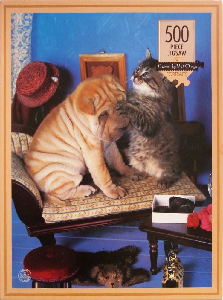 A Shar-Pei puppy and a fluffy kitten sitting together on an ornate Victorian-style fainting couch.