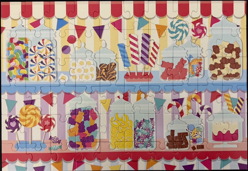 An illustration of a candy shop shelf filled with glass jars of sweets, colorful lollipops, and striped awnings.