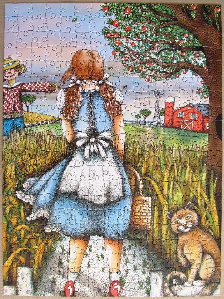 Illustration of a girl with auburn braids standing in a cornfield with a scarecrow, a cat, and a red barn nearby.