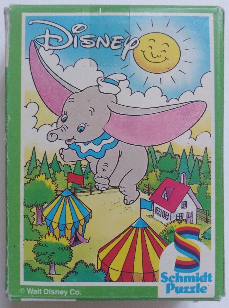 Illustration of the flying elephant Dumbo soaring over a colorful circus landscape under a smiling sun.