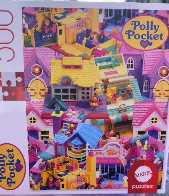 A collage of miniature colorful toy dollhouses and small plastic figures.