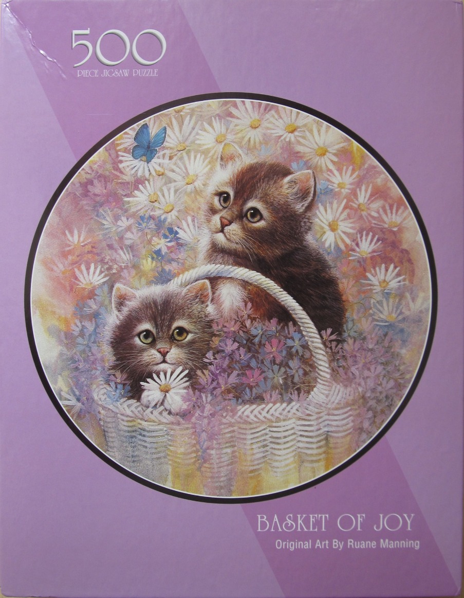Two fluffy kittens sitting in a white wicker basket surrounded by daisies and wildflowers.