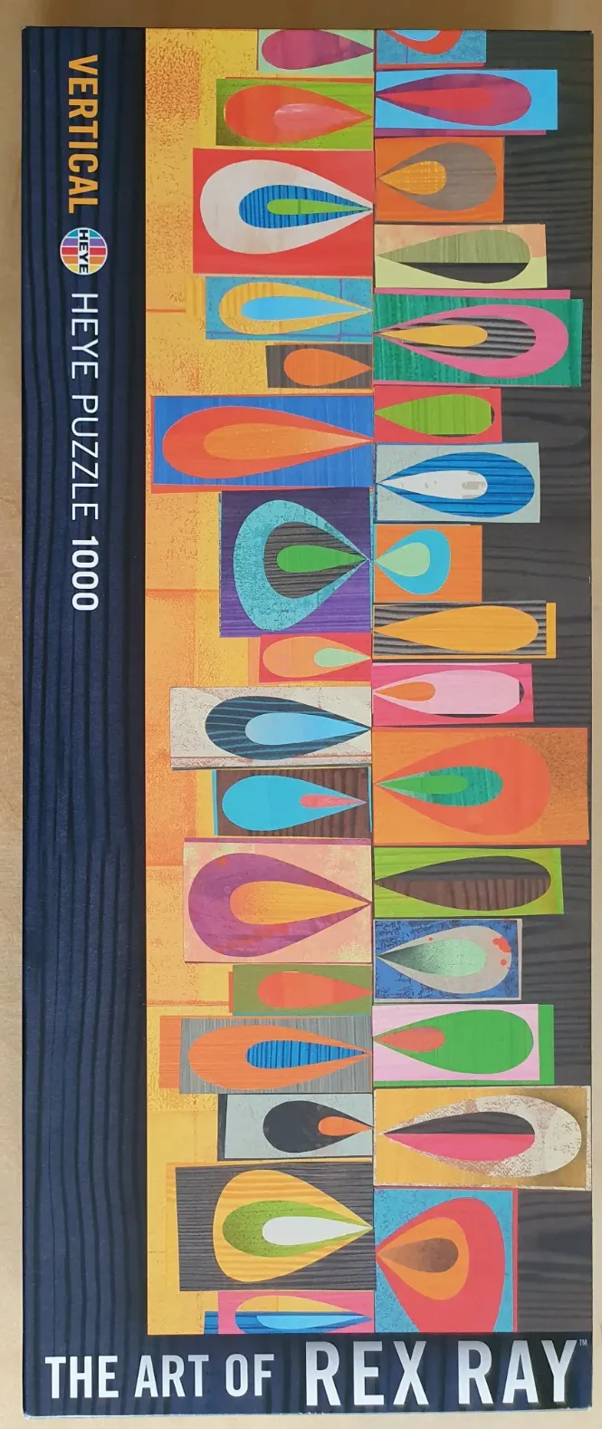 Abstract art piece by Rex Ray featuring stacked rectangular blocks with colorful teardrop or petal shapes inside.