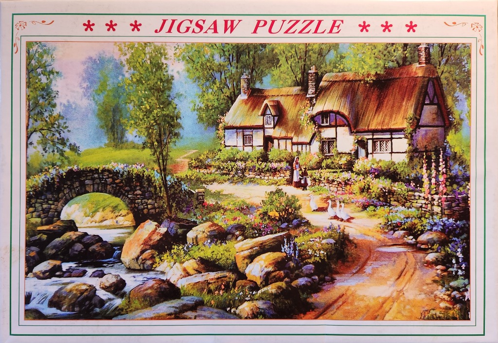 A thatched cottage beside a stone bridge and stream, surrounded by lush gardens and three white geese on a dirt path.