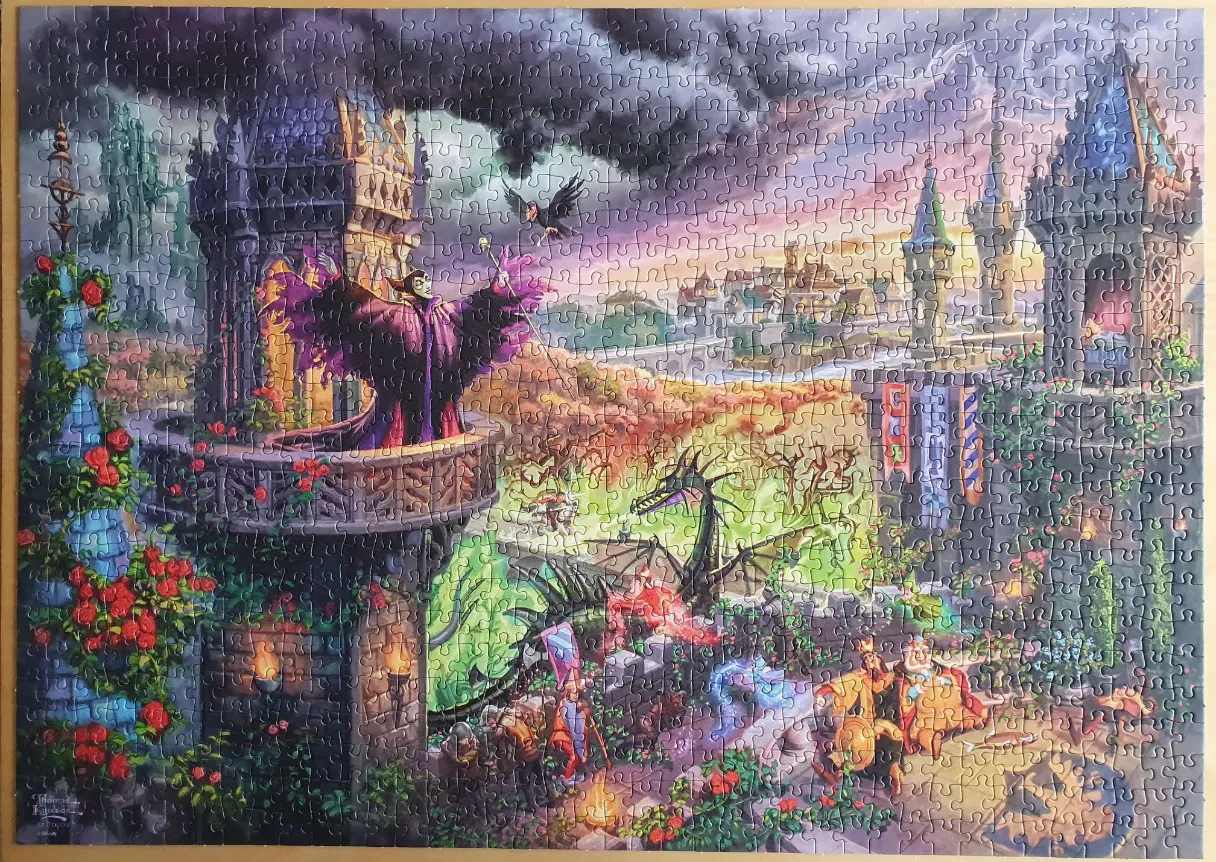 Maleficent stands on a castle balcony with her raven, while a dragon looms over a scene with knights below.