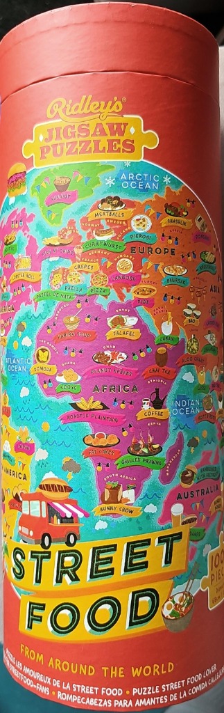 Illustrated world map decorated with various international street food dishes and labels.