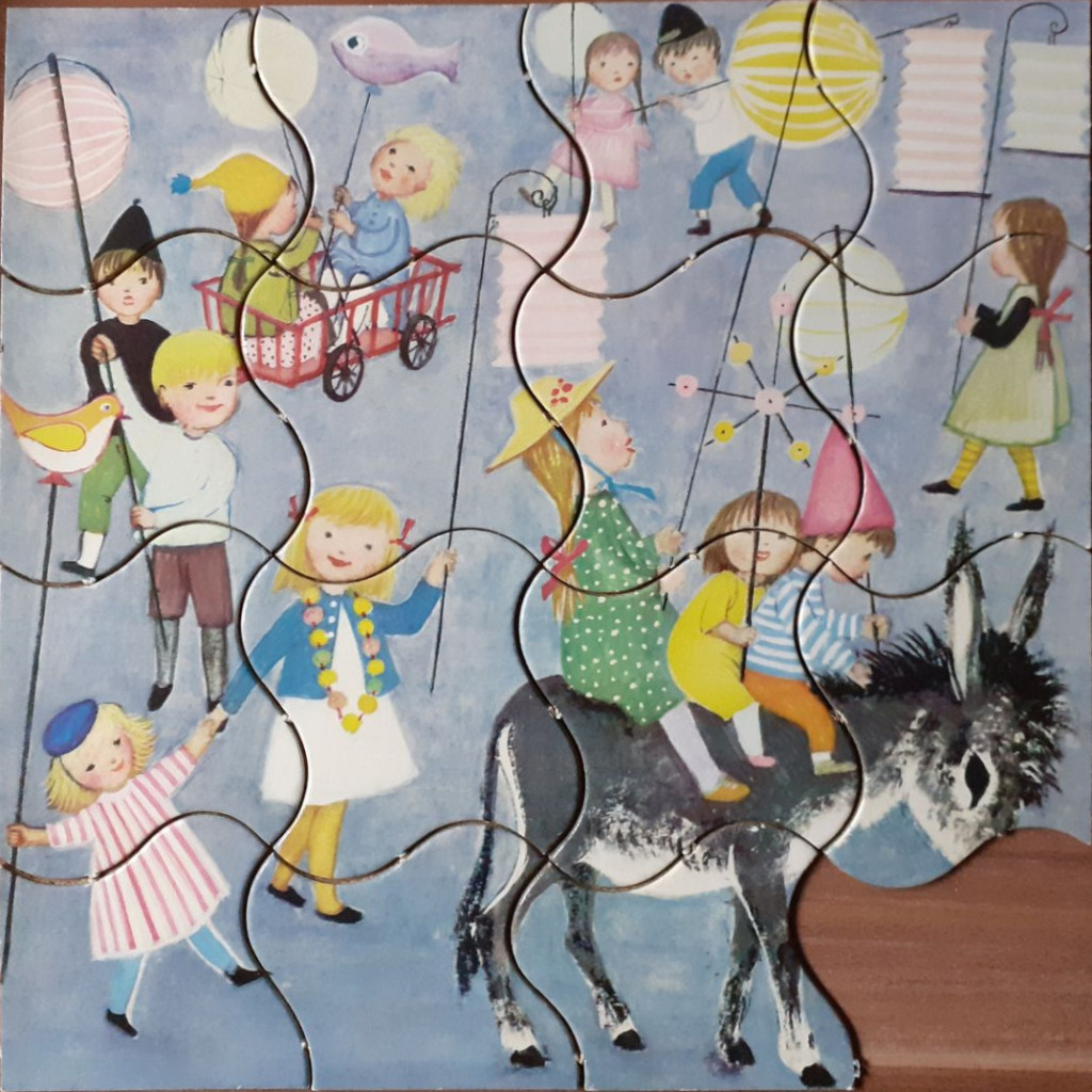 Children participating in a nighttime lantern parade with a donkey, illustrated in a vintage storybook style.