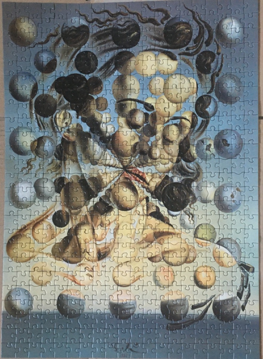 A surrealist painting of a floating face composed of multiple spheres against a blue background.