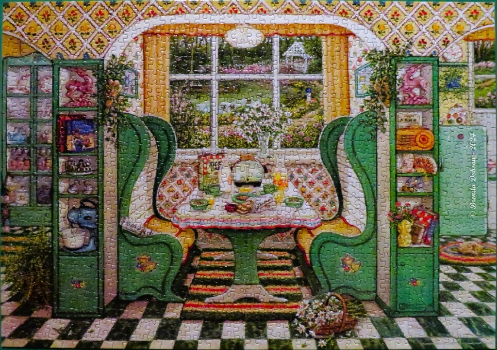 A cozy, vintage-style illustration of a sunlit breakfast nook with green cabinets and a garden view.