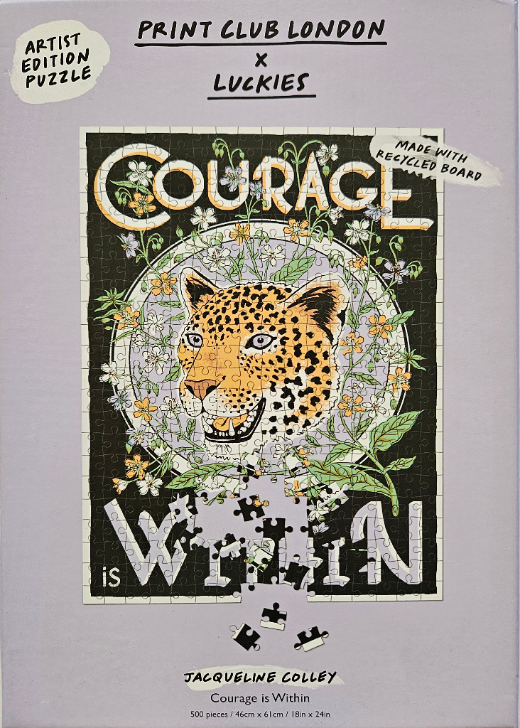 An illustration of a leopard head surrounded by flowers with the text Courage is Within.