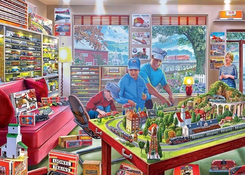 A father and two sons playing with a detailed model train set in a hobby room.