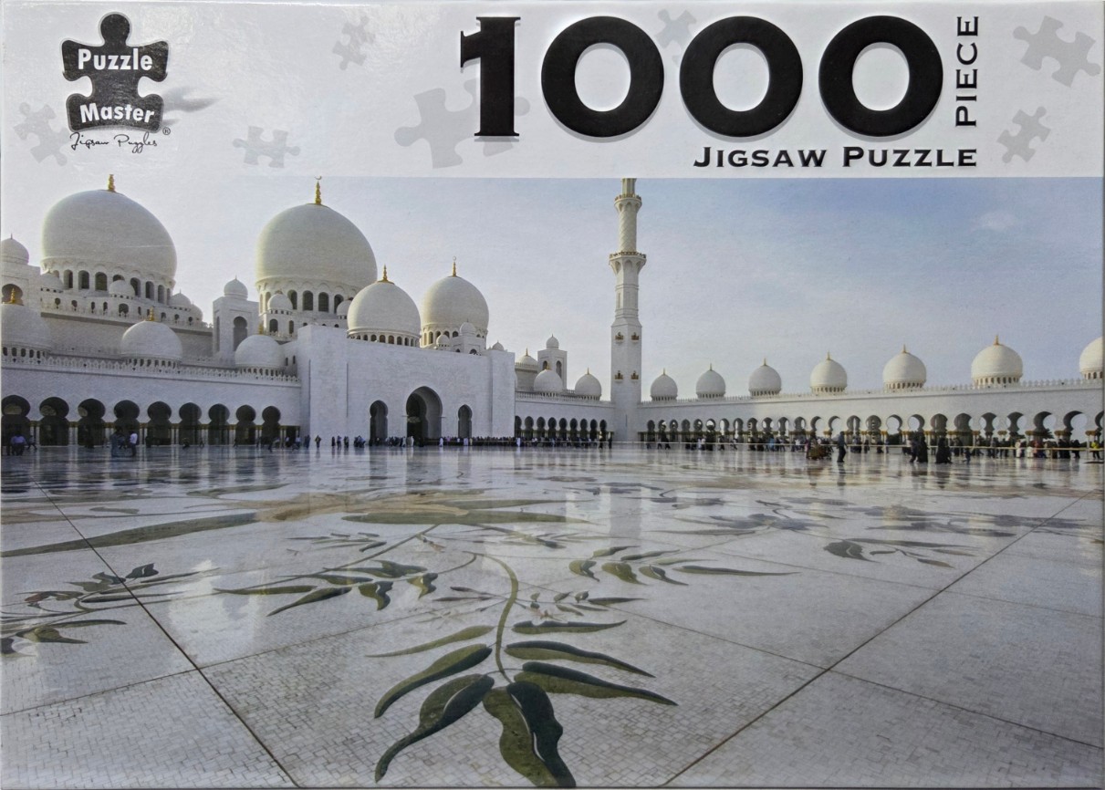 The Sheikh Zayed Grand Mosque in Abu Dhabi with its iconic white domes and tiled courtyard.