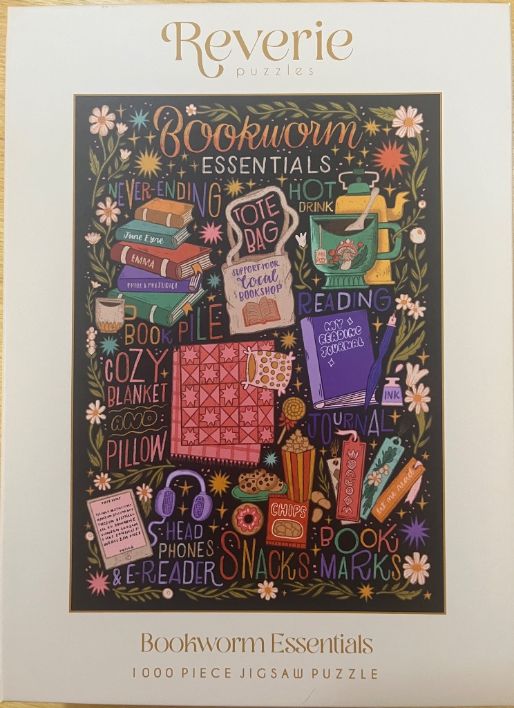 Illustrated collection of bookworm essentials on a dark background