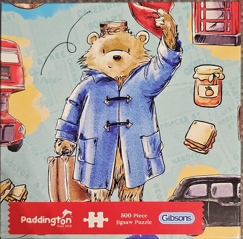 A whimsical illustration of a bear in a blue coat tipping his red hat against a background of London-themed icons.