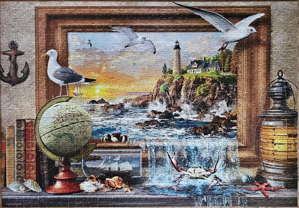 A nautical-themed scene featuring a framed coastal painting, a globe, and maritime artifacts on a shelf.