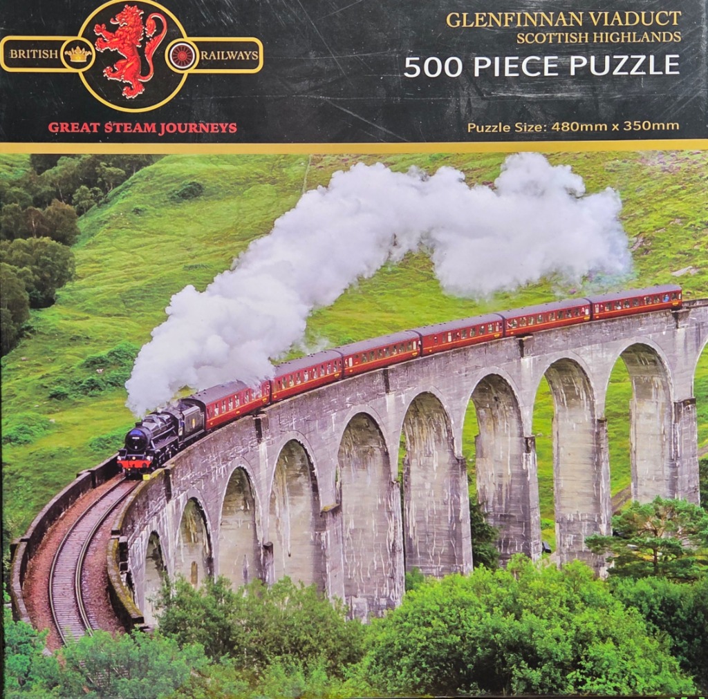 A steam train pulling red carriages across the Glenfinnan Viaduct in the Scottish Highlands.