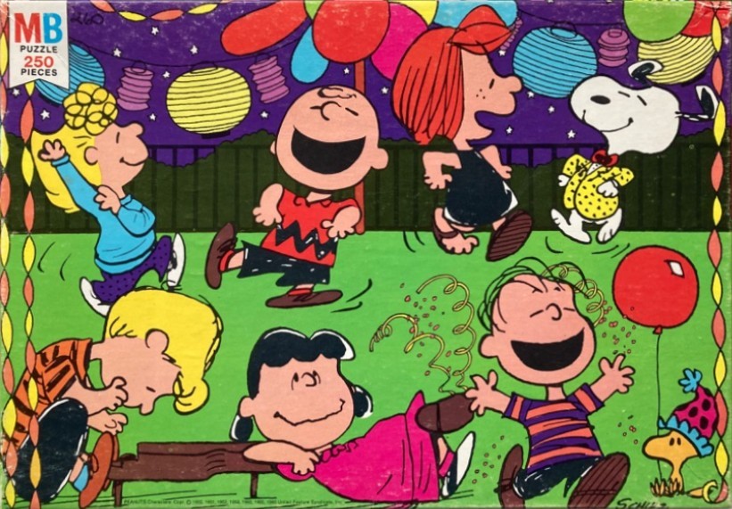 Peanuts characters including Charlie Brown, Snoopy, and Lucy dancing at a festive outdoor party.