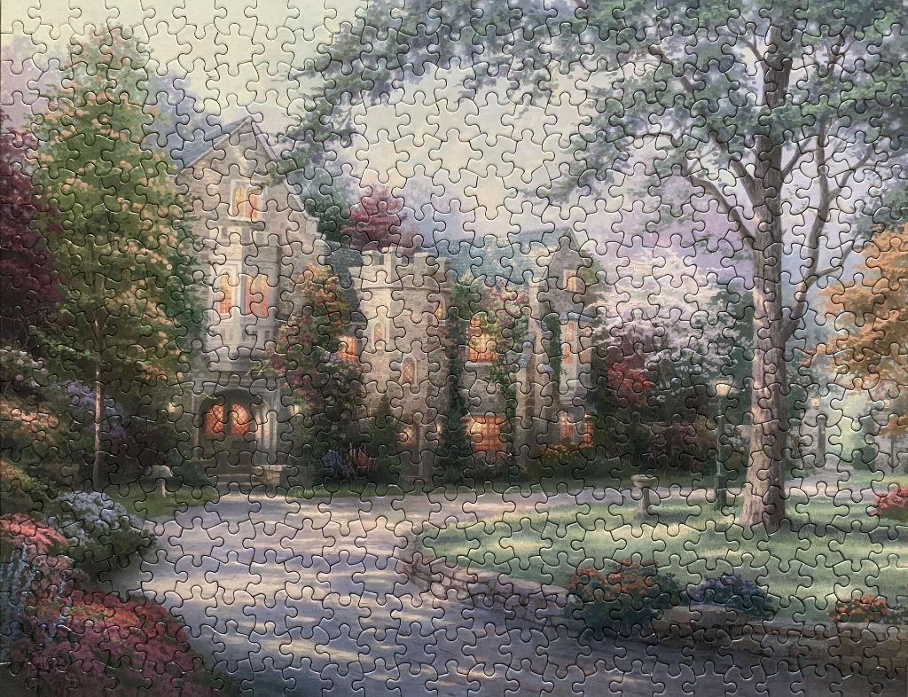 A romanticized painting of a stone manor house at twilight, surrounded by lush gardens and large trees.