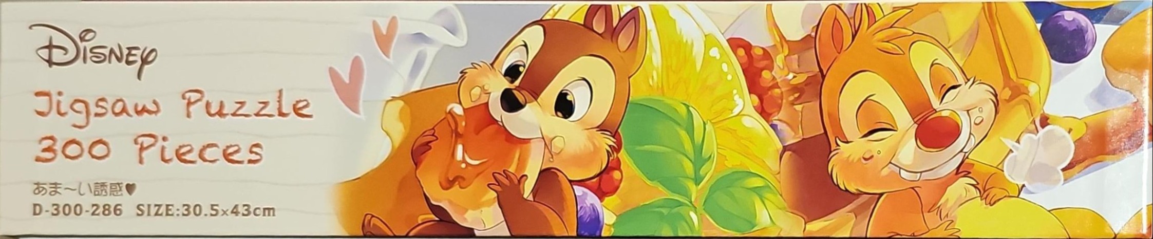 Chip and Dale enjoying fruit and pastries in a vibrant, cheerful illustration.