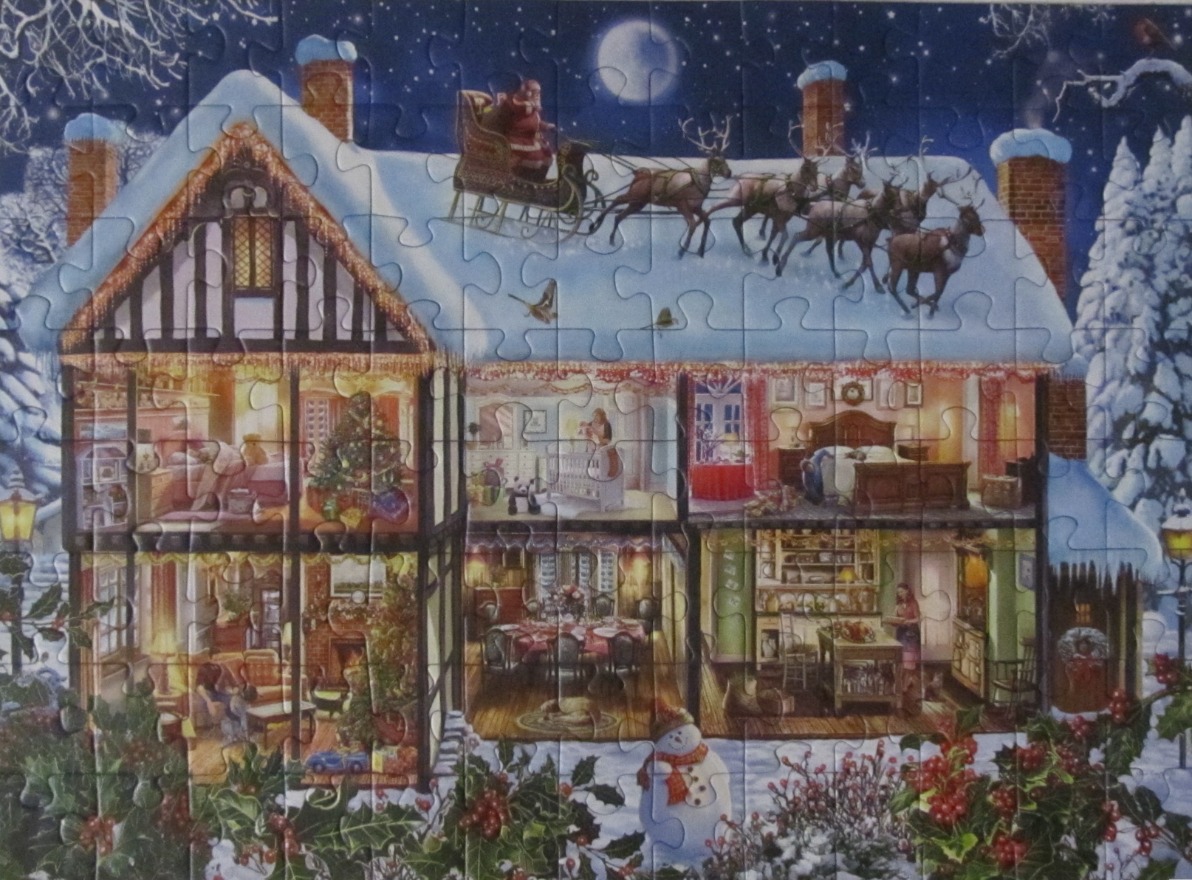 A dollhouse-style cross-section of a cozy Tudor home at night with Santa flying overhead in his sleigh.