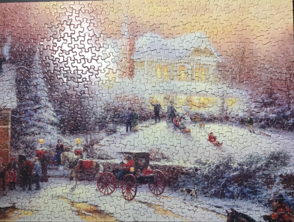 An idyllic snowy winter scene at dusk featuring a horse-drawn carriage in front of a Victorian home.