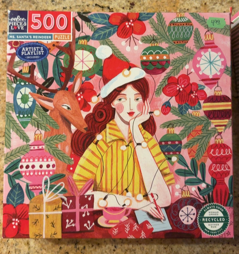 An illustration of a woman in a Santa hat writing a letter with a reindeer nearby amidst Christmas decorations.
