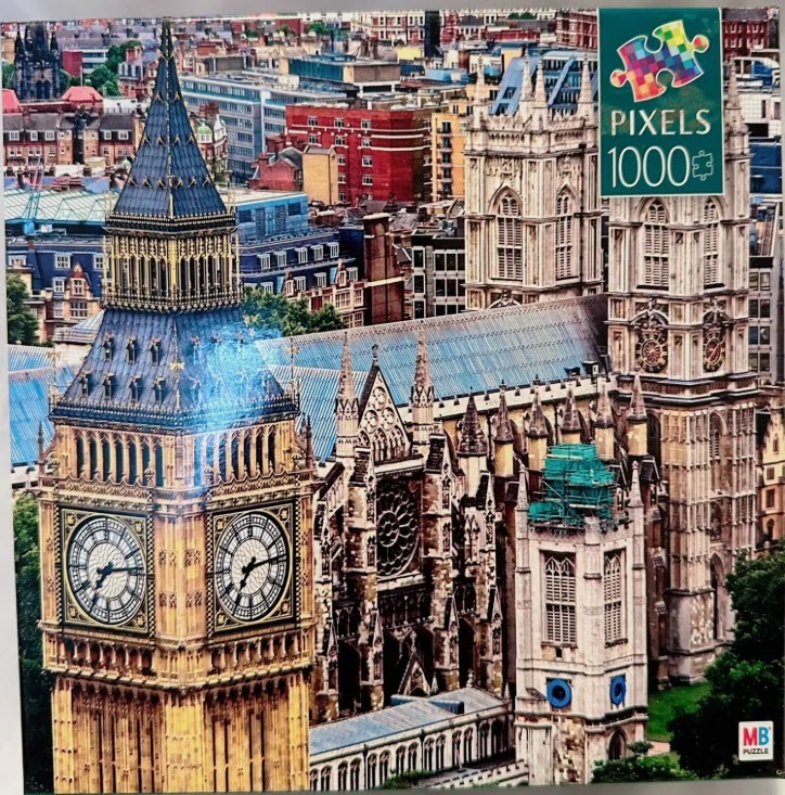 A high-angle view of Big Ben and Westminster Abbey in London, featuring intricate gothic architecture and city buildings.