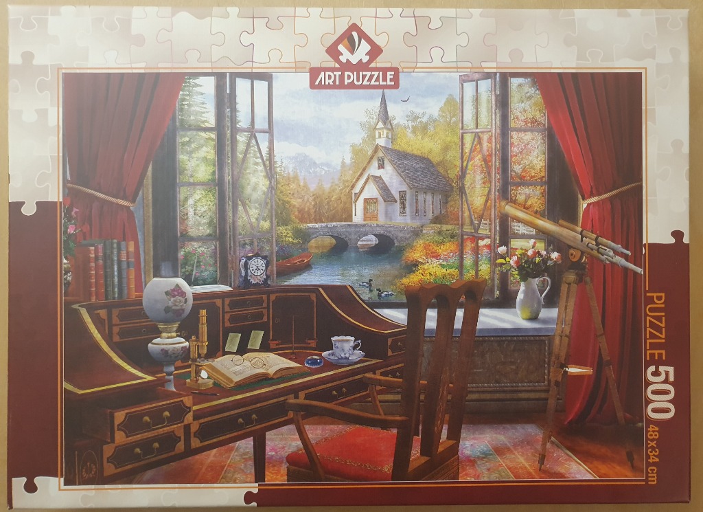 A cozy study room with a desk overlooking a beautiful church, bridge, and stream landscape painting.