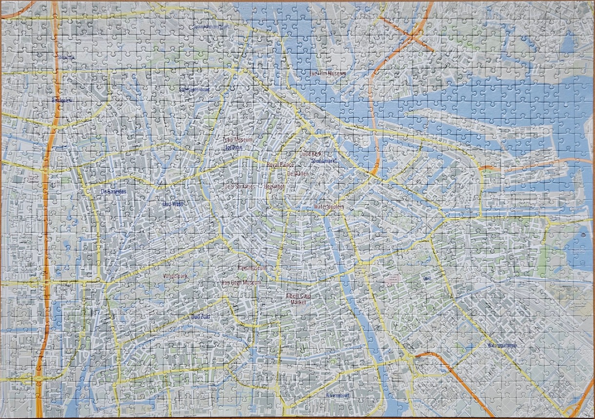 A detailed city map of Amsterdam, Netherlands, featuring prominent canals, districts, and landmarks.