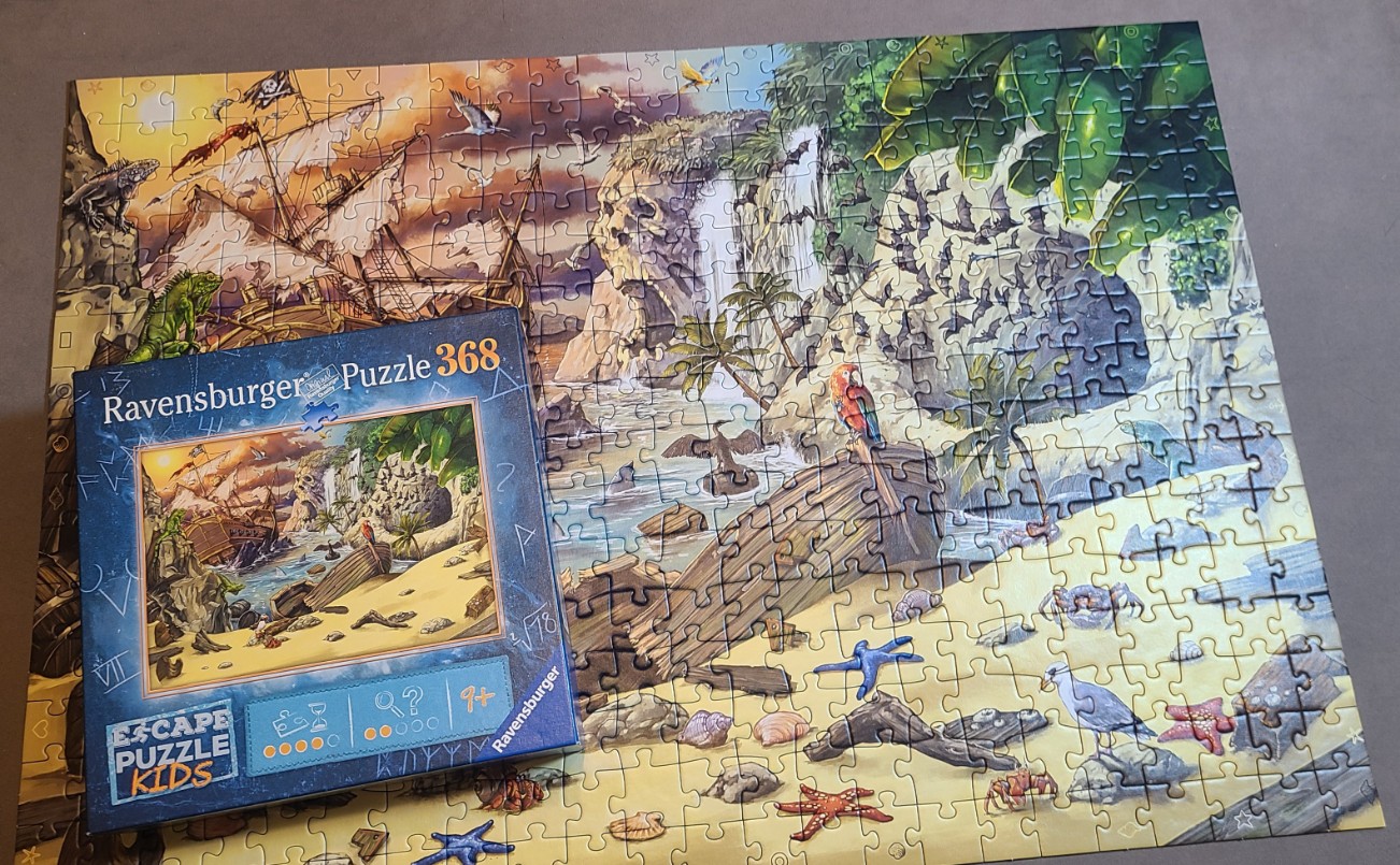 Pirate ship and waterfall scene on a tropical beach with iguanas and parrots.