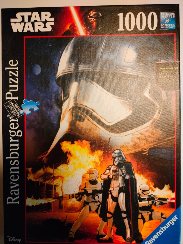 Captain Phasma and First Order stormtroopers standing before a large chrome helmet against a fiery background.