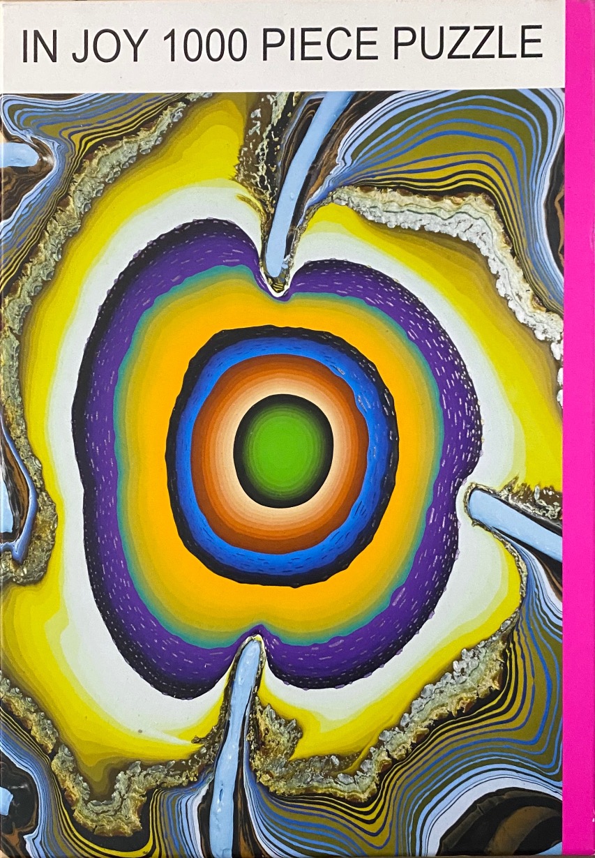 Abstract art of concentric, vibrant, multi-coloured rings resembling a geode or flower with fluid lines.
