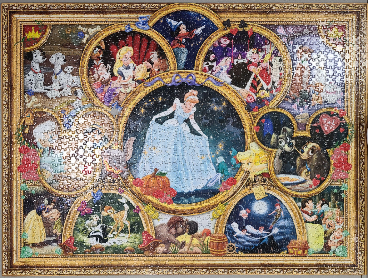 Collage of classic animated characters in an ornate golden frame.